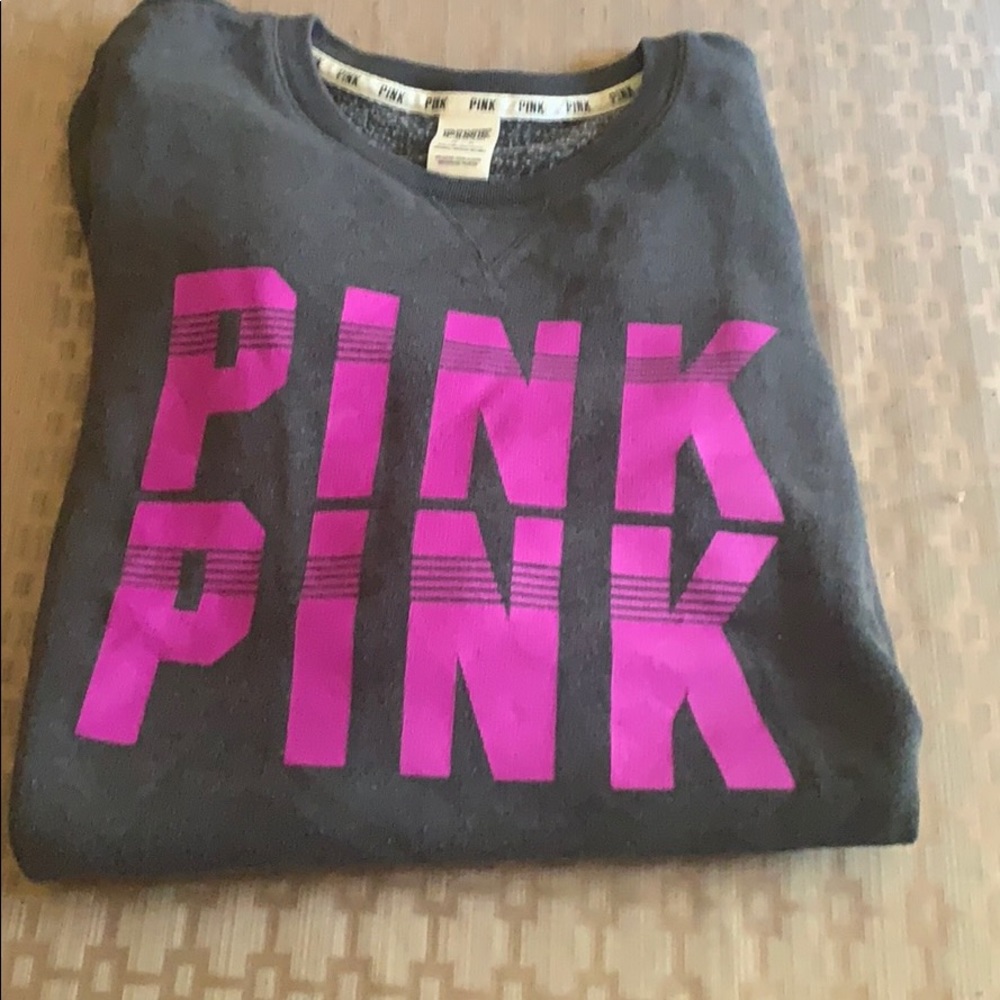 Pink sweat shirt.